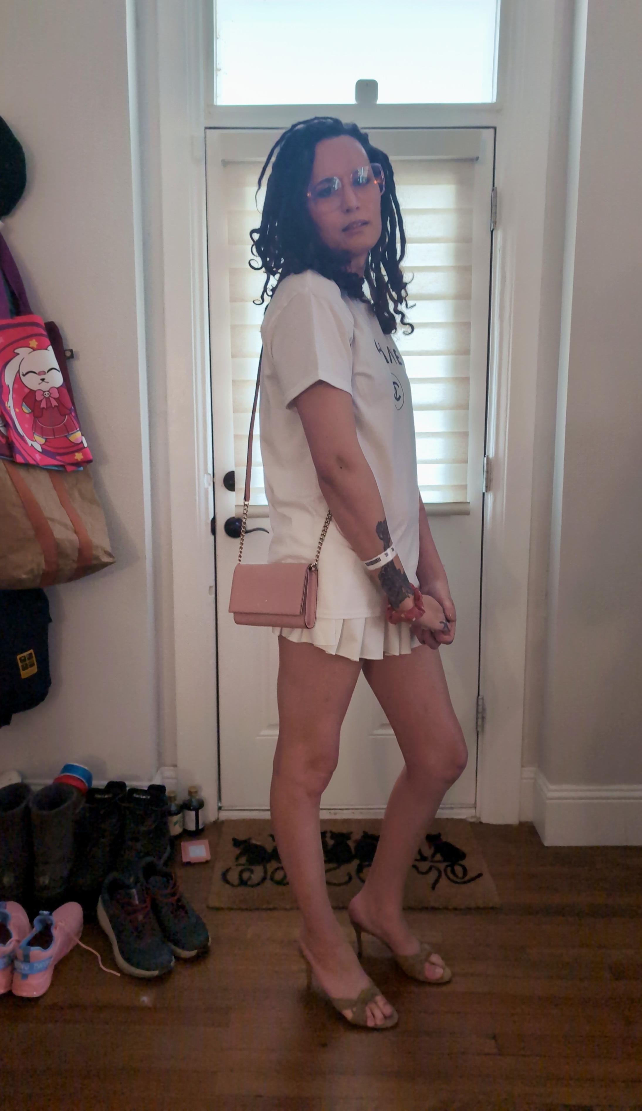 Similar picture of me but its a side shot and I have my mouth slightly open. You can see more of my heels and purse from this angle.